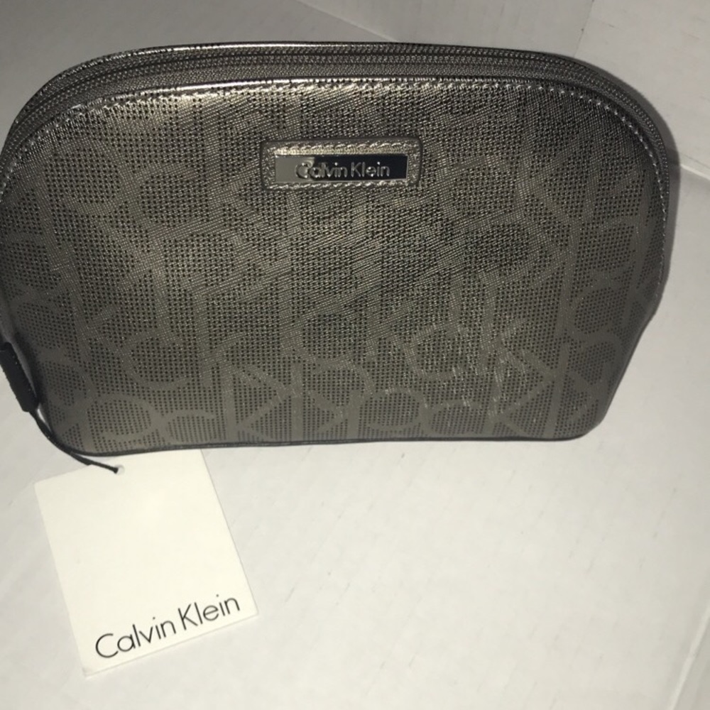 Brand new Calvin Klein metallic cosmetic bag